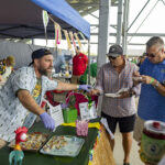 cook team handing out food samples at the ohio eggfest big green egg bbq competition and festival