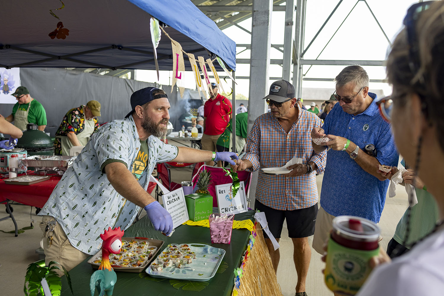 cook team handing out food samples at the ohio eggfest big green egg bbq competition and festival