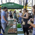 the ohio eggfest big green egg bbq competition handing out food samples to guests
